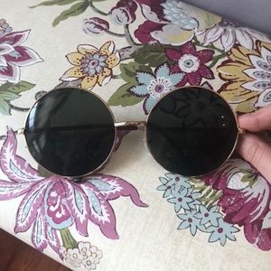 Large, round sunglasses
